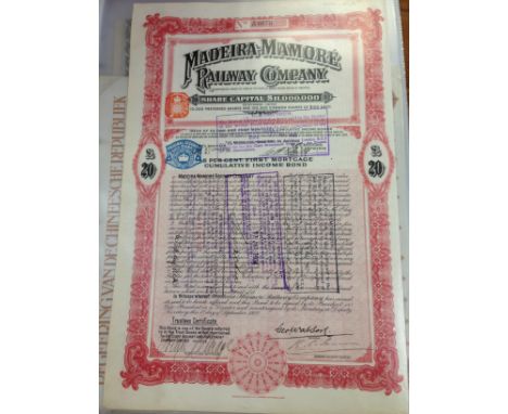 A COLLECTION OF SHARE, BOND, DEBENTURE AND SIMILAR CERTIFICATES IN LARGE BINDER, MANY RAILWAY RELATED, RUSSIAN, LATIN AMERICA