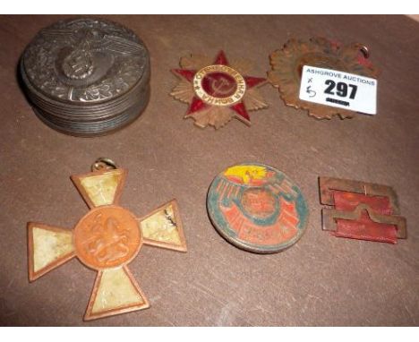 A Reproduction German WW II Nazi Snuff Box, with eagle and swastika emblem to either side and four medals.  . €20-30.