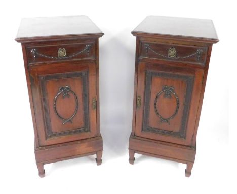 A pair of Adams style Edwardian mahogany side dining pedestals, each with a drawer carved with harebell swags, one with fitte