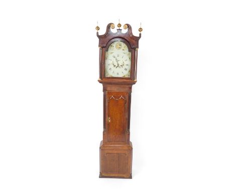 A George III mahogany and oak long case clock, the break arch dial painted with shells, thistles, rose and bird, chapter ring