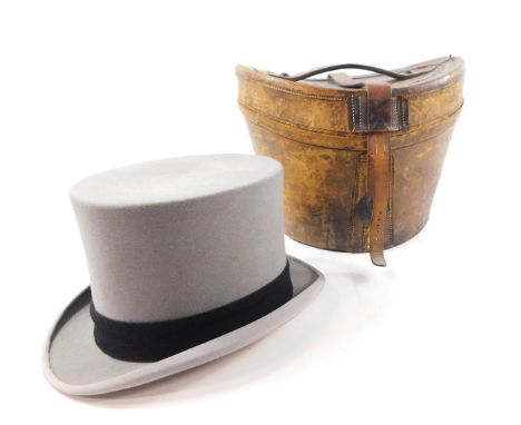A grey wool felt top hat by Herbert Johnson, 38 New Bond Street, London., inner length 7 7/8", 6 1/2" wide, in a vintage tan 