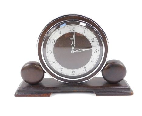 A Metamec Art Deco oak and chrome mantel clock, circular dial with silvered chapter ring bearing Arabic numerals, clockwork m