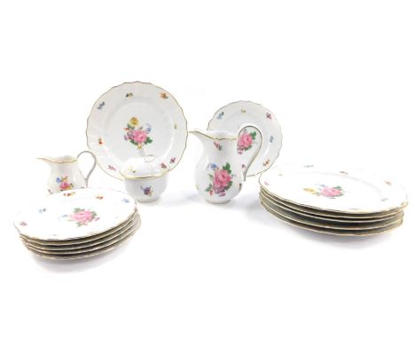 A set of six Hutschenreuther early 20thC porcelain dinner plates, of fluted form, painted with sprays of flowers, for H. Bath