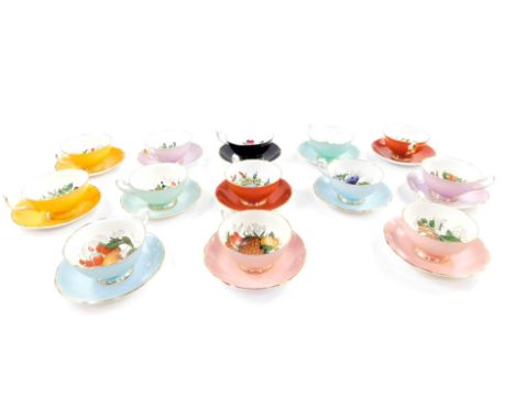 A Shelley Aynsley and Edwardian porcelain harlequin tea service, decorated with fruit, against various coloured grounds, comp