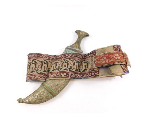 A Yemeni Jambiya, the horn hilt with metal embellishments, double edged steel blade and Asib cloth and metal bound, on a wove