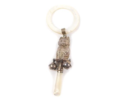 A George V silver and mother of pearl baby's rattle and teething ring, cast as a seated cat, with two bell attachments, Birmi