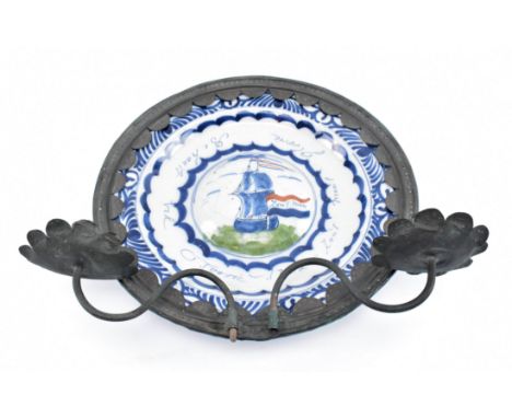 A late 18th century Dutch Delftware blue and white charger plate, presented in contemporary copper mount with sconces. The ch
