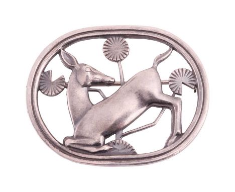 Georg Jensen - a brooch depicting a kneeling fawn and flowers, fitted with a hinged pin stem and roll-over safety catch, desi