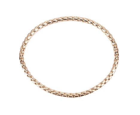 An 18ct yellow gold stretch bracelet by Chimento, with oval curved links, stamped '750' to the reverse together with maker's 