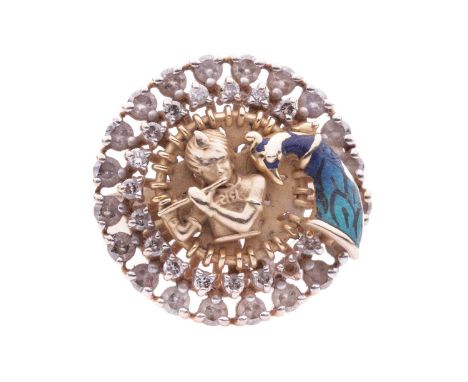 A diamond-set dress ring depicting Krishna and a peacock, the raised figure surrounded by a two-tiered round frame claw-set w