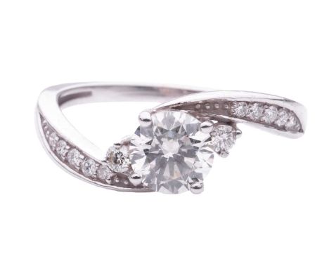 A Diamond set crossover engagement ring, featuring a round brilliant cut diamond with a stated weight of 0.81ct, H colour and