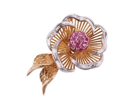 A ruby and diamond flower brooch, featuring a central cluster of rubies, set with single-cut diamonds to the edge of each pet