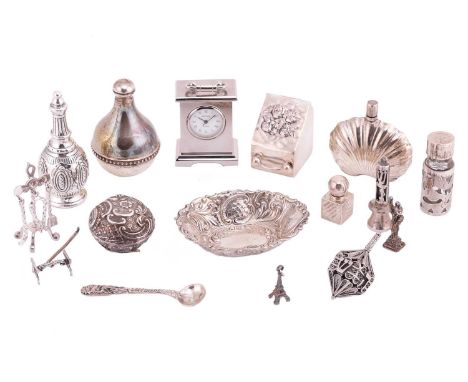A collection of miniature silver pieces comprising four silver perfume bottles, a silver pin tray, a miniature set of silver 