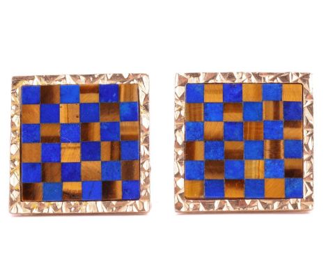 A pair of lapis lazuli and tiger's eye chequerboard cufflinks in 9ct gold, each comprising a square panel inlaid with lapis l