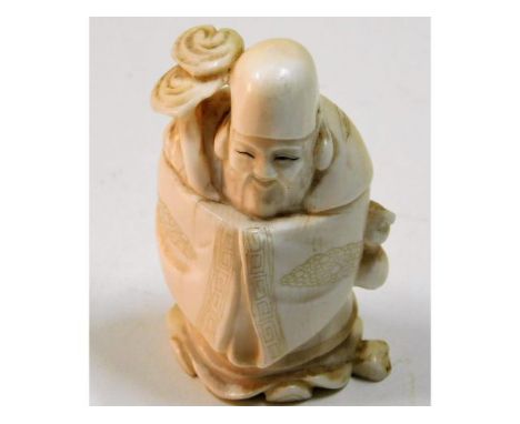 A c.1910 carved Japanese ivory netsuke, 29.1g, 2in tall 