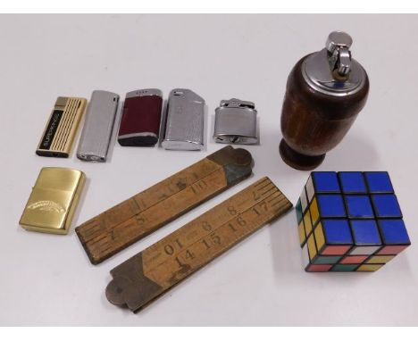 A wooden table lighter, other lighters, two rules &amp; a Rubik style cube