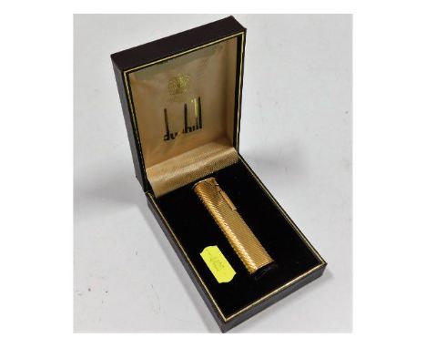 A boxed Dunhill gold plated lighter, used, some minor wear to plate, two dents to underside of base