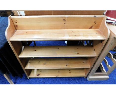 An open low level pine book shelf, 36in wide x 35.75in high x 7.5in deep