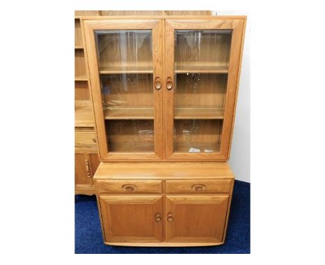 A retro styled Ercol elm bookcase &amp; cupboard, 63.5in high x 36in wide x 17.5in deep