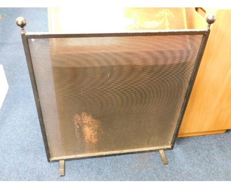 A heavy mesh fire screen 36.5in high x 32.25in wide