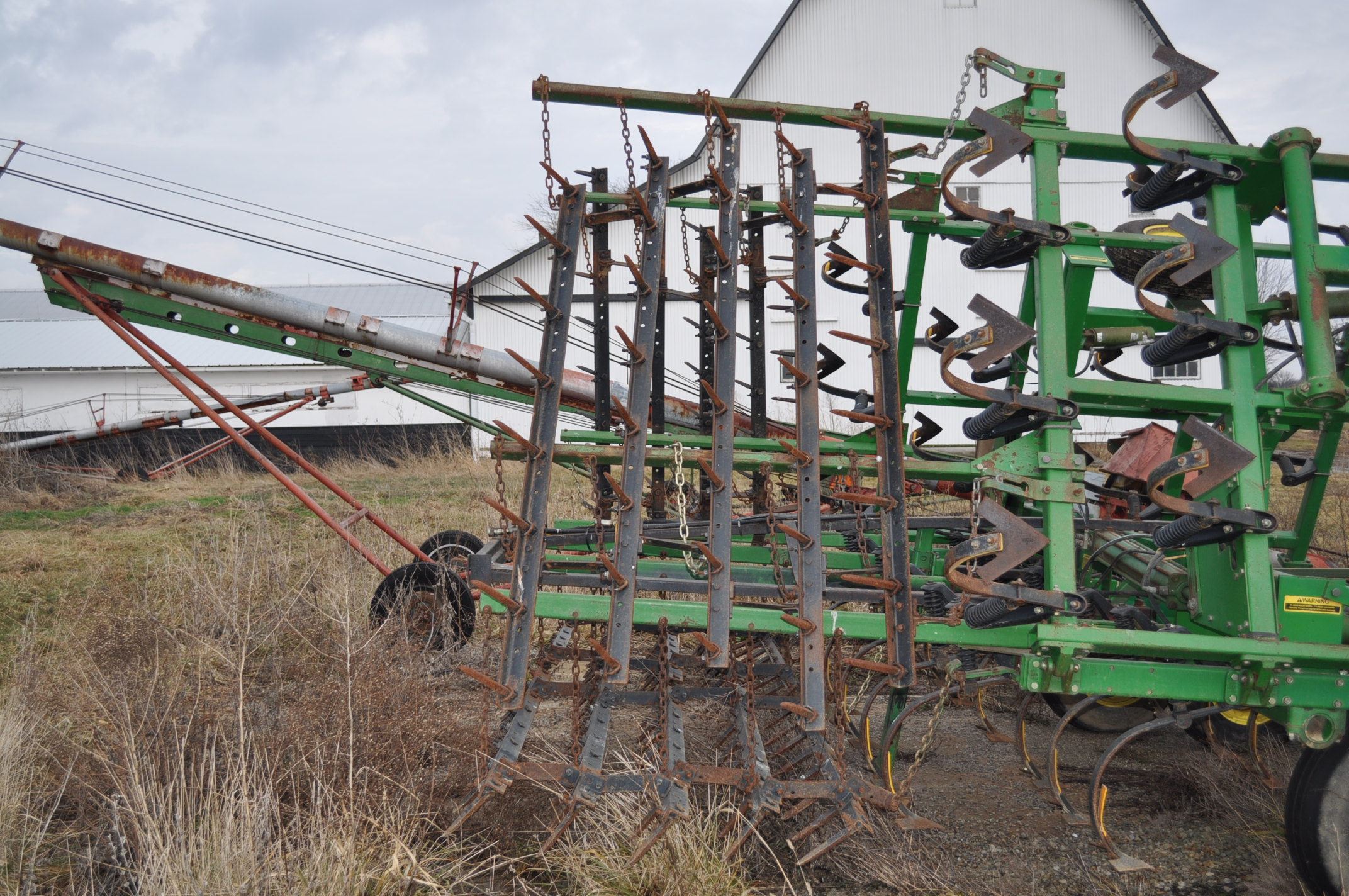 25' John Deere Field cultivator, spring shank, new sweeps, poly shank