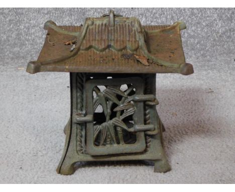 A vintage pierced cast iron Japanese pagoda lantern with bamboo detailing. H.20cm 