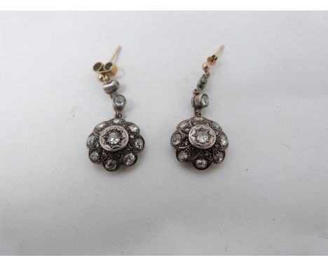 A pair of Victorian old mine diamond cluster drop earrings. Each earing set with nineteen diamonds. The central cushion shape