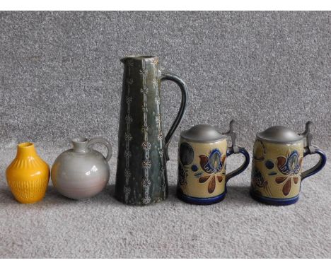 A collection of West German pottery. Including two salt glaze German steins with pewter lids and abstract deer and floral and