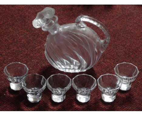 A set of six antique cut crystal shot glasses with faceted bases and a blown glass handled decanter with stopper. H.17cm (tal