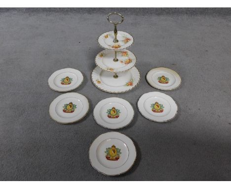 A vintage three tier floral design cake stand by Clarice Cliff along with a set of six Royal commemorative plates. H.34cm (ca