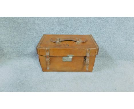 A vintage leather travel picnic set by Dawson of Edinburgh with kettle and burner, tea and coffee cannisters, cup and saucers