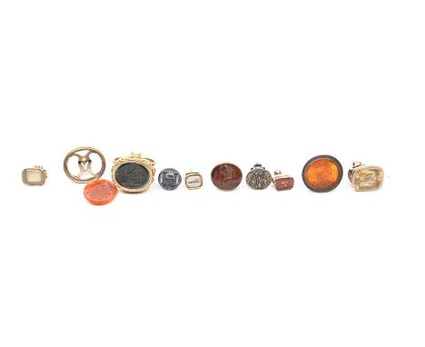 A collection of ten various late George III seal fobs, seven in unmarked yellow metal mounts, three in base metal, all set wi