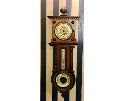 A late Victorian mahogany wall clock, thermometer and barometer combined, circa 1900, globe finial over a dental cornice, abo