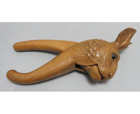 A nineteenth century Black Forest carved novelty nutcracker in the form of a rabbit's head.  20 cm long. (1)Condition: In goo
