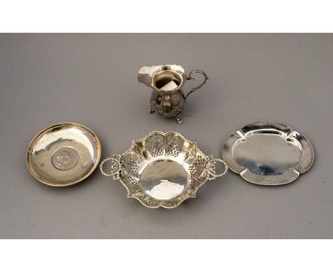 Assorted silver, to include a pierced twin handled bon bon basket, a cased trinket dish with inset Churchill coin, a quatrefo