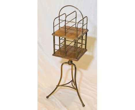 A late Victorian/Edwardian Aesthetic movement oak and brass revolving bookcase, circa 1900, brass mounted book dividers with 