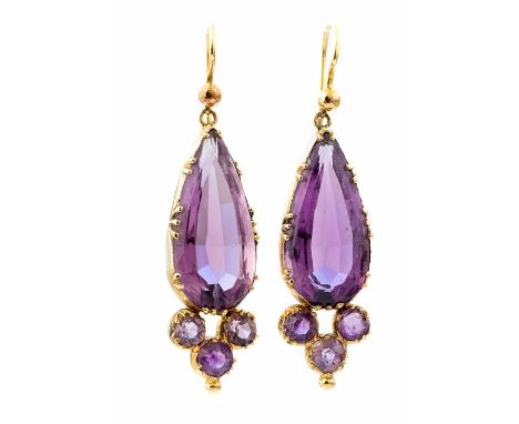 A pair of yellow metal amethyst pendant Earrings, each collet set pear-cut amethyst and three further round-cut amethyst belo