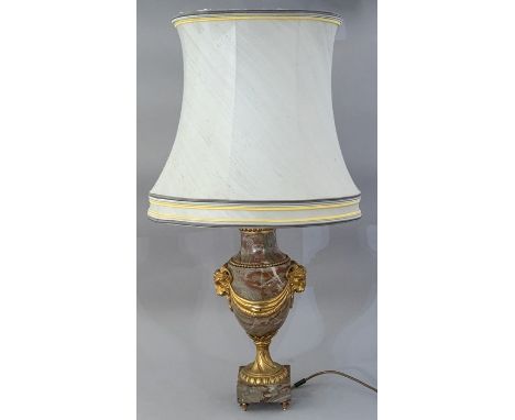 A pink veined marble table lamp base, of Louis XVI design, 20th Century, cast gilt metal mounts comprising rams masks and dra