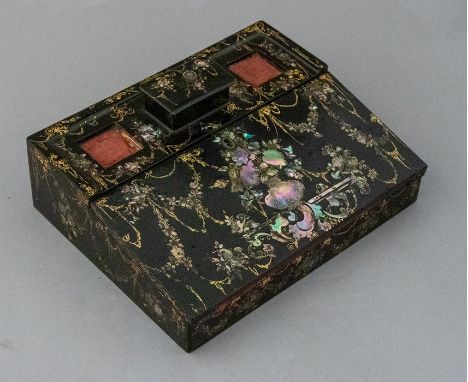 A mid Victorian black papier mache writing slope, circa 1860, mother of pearl inlaid with gilt decoration, double ink  cube s