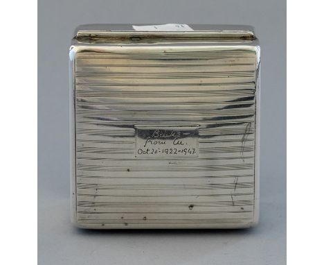 An early 20th Century silver table cigarette casket, engine turned with presentation engraving to lid, marks rubbedCondition: