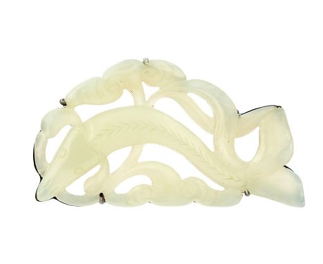 A carved celadon jade openwork Brooch depicting fish amongst leafage scrolls on a  white metal mount with pin fastening, 70mm
