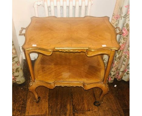 A Louis XV revival Français Kingwood and gilt mounted etargere, serpentine/cartouche shaped, two tier shelves united by hexag