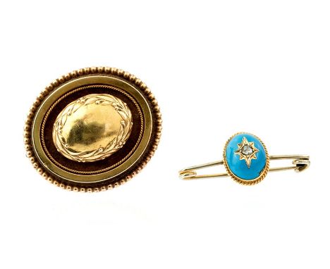 A yellow metal Victorian target Brooch/Pendant with beaded border and leaf and berry wreath, 10.4g, 40mm wide together with a