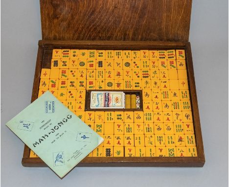A vintage Chad Valley Mah-jongg set with wooden case and instructions