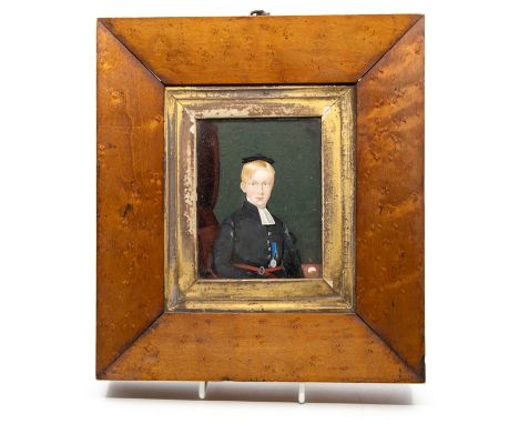 A mid Victorian reverse painted on glass portrait miniature, C.J. Betham, aged 14, 1862, 10 by 8cm, in a birds eye maple fram