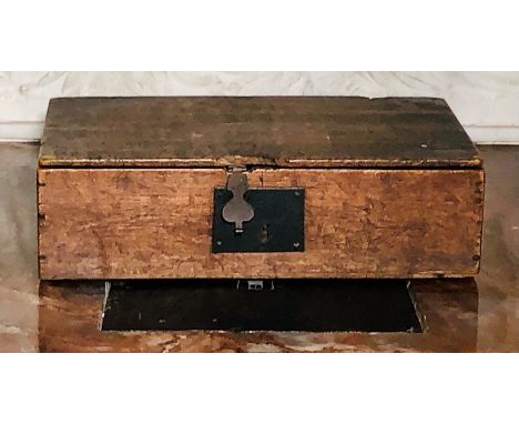 A late 17th Century oak bible box, circa 1680, single plank hinged top above metal keyhole in rectangular form. 12cm H x 44cm