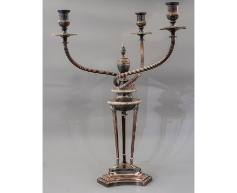 An Edwardian Sheffield plated triple light candelabra, of Empire design on a trefoil plinth, height 61cm, with a plated serpe