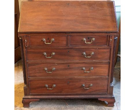 A George III mahogany bureau, circa 1760, in the manner of Thomas Chippendale, fall front enclosing interior with secret draw