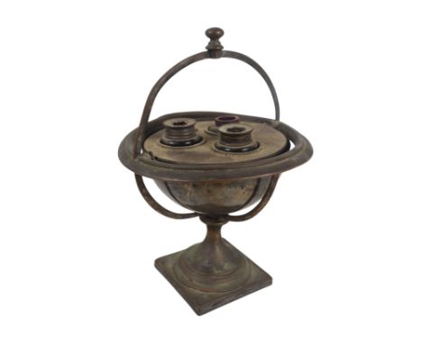 A late 19th century silver plated 'ships' ink stand - of globe form and mounted on a gimble raised on a square base. 
