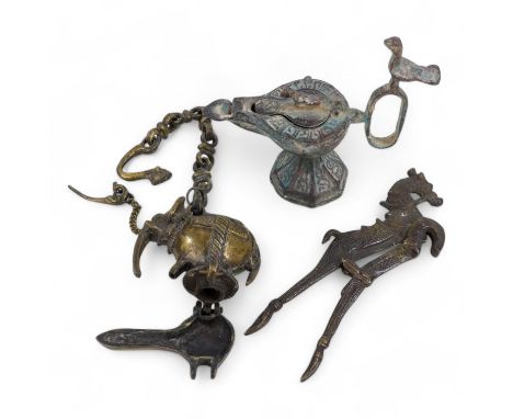 A bronze oil lamp - with bird finials to cover and handle, together with another elephant form oil burner and a betel nut cut
